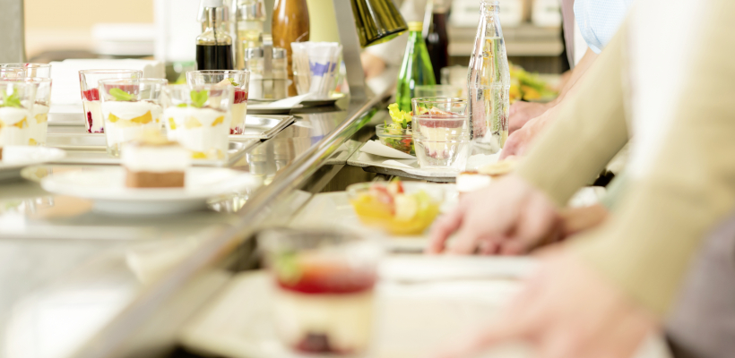 Desserts at cafeteria people with serving tray self service canteen