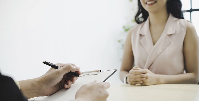 business HR manager with resume and young woman during job interview and explaining about his profile sitting in meeting room at office, human resources, business job interview, employment concept